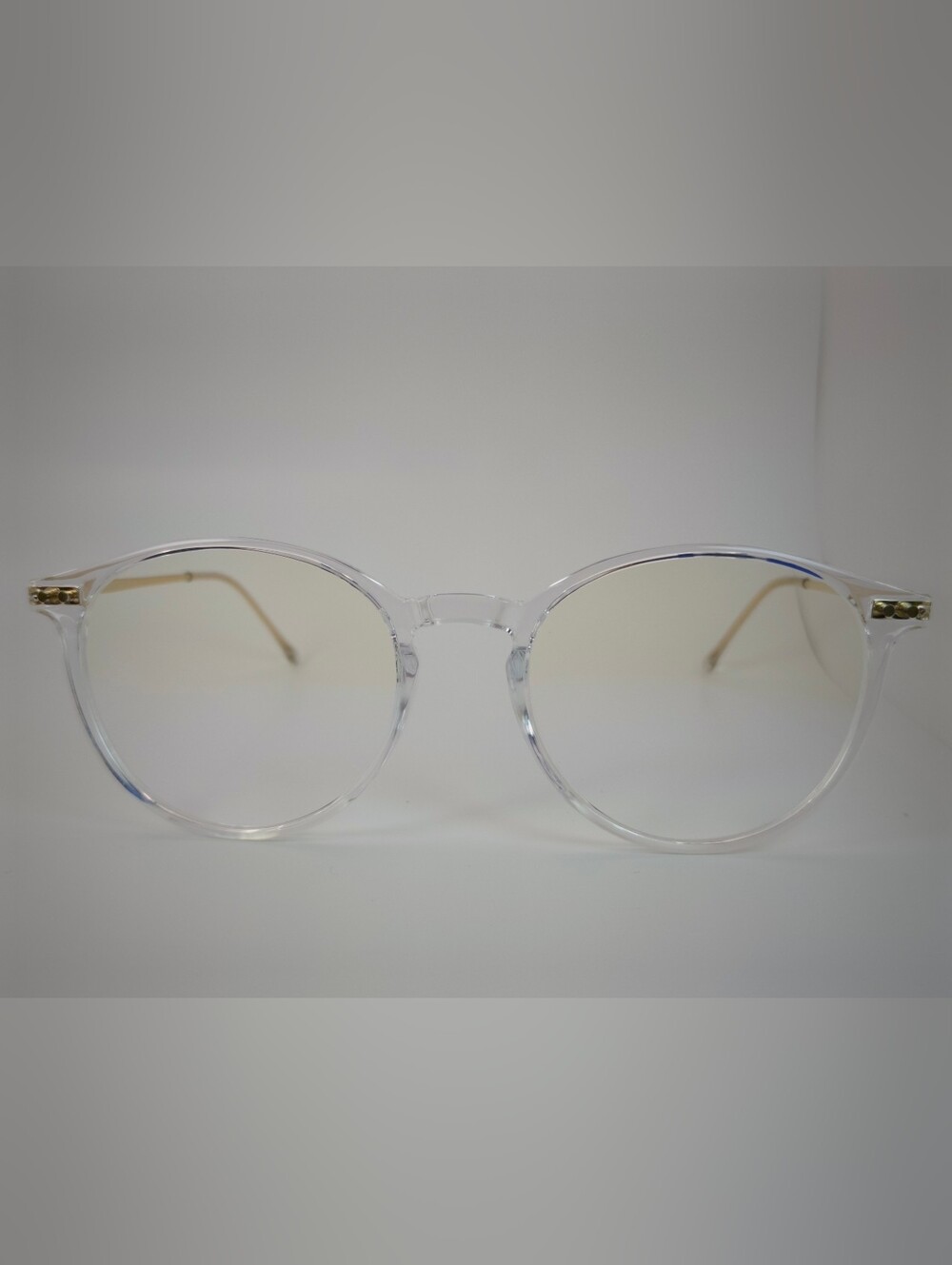 Amity. Clear Round Frame Glasses with Subtle Gold Temples. Opthalmic